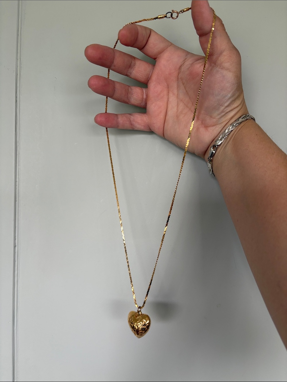 Vintage gold tone costume jewelry with heart pendant